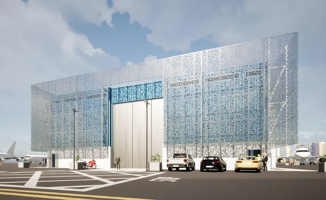 Bâtiment moderne proche des avions et des voitures.