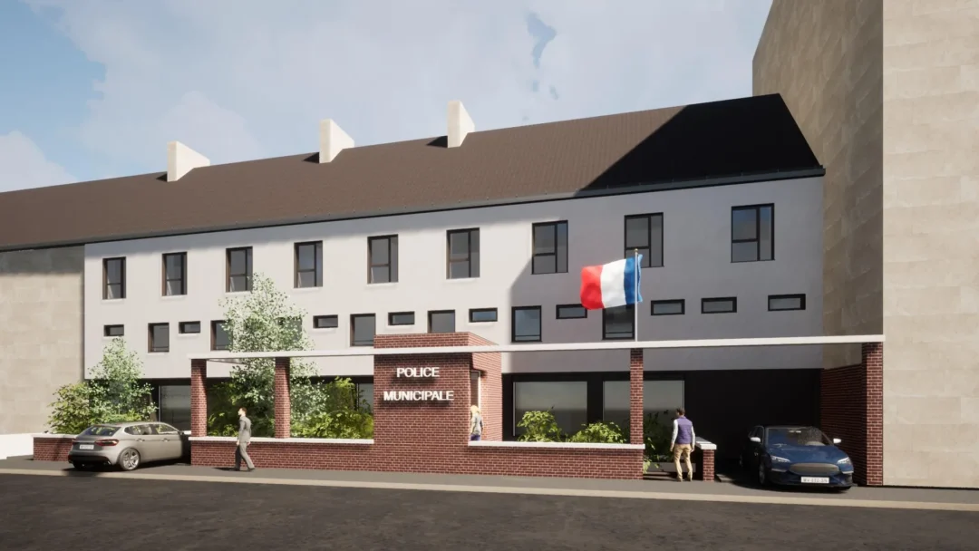 Façade du commissariat avec drapeau français.